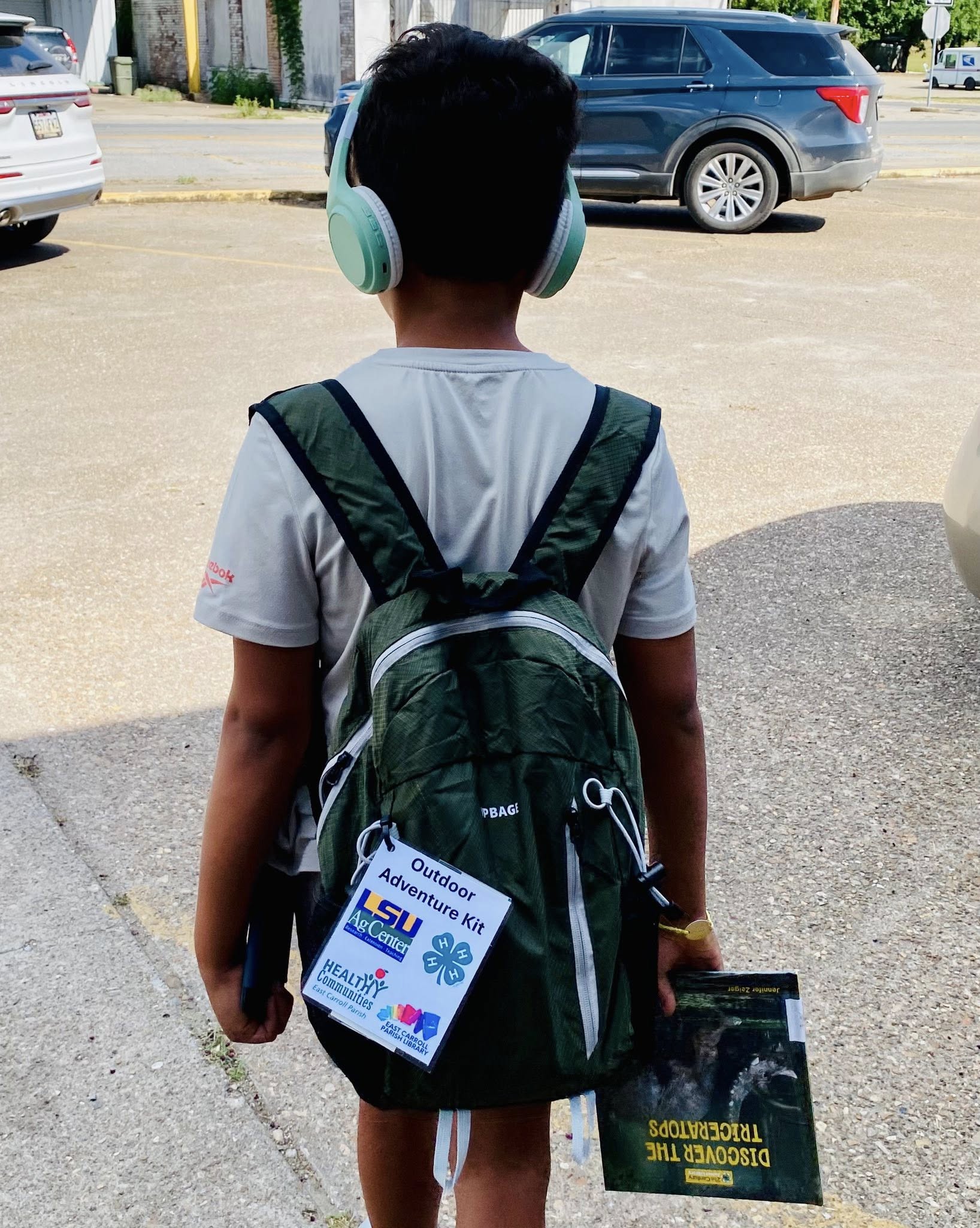 A boy wearing an Outdoor Adventure Backpack.